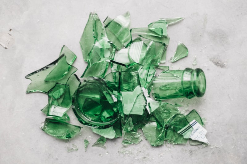 Green broken bottle on ground | Know your enemies when battling addiction 